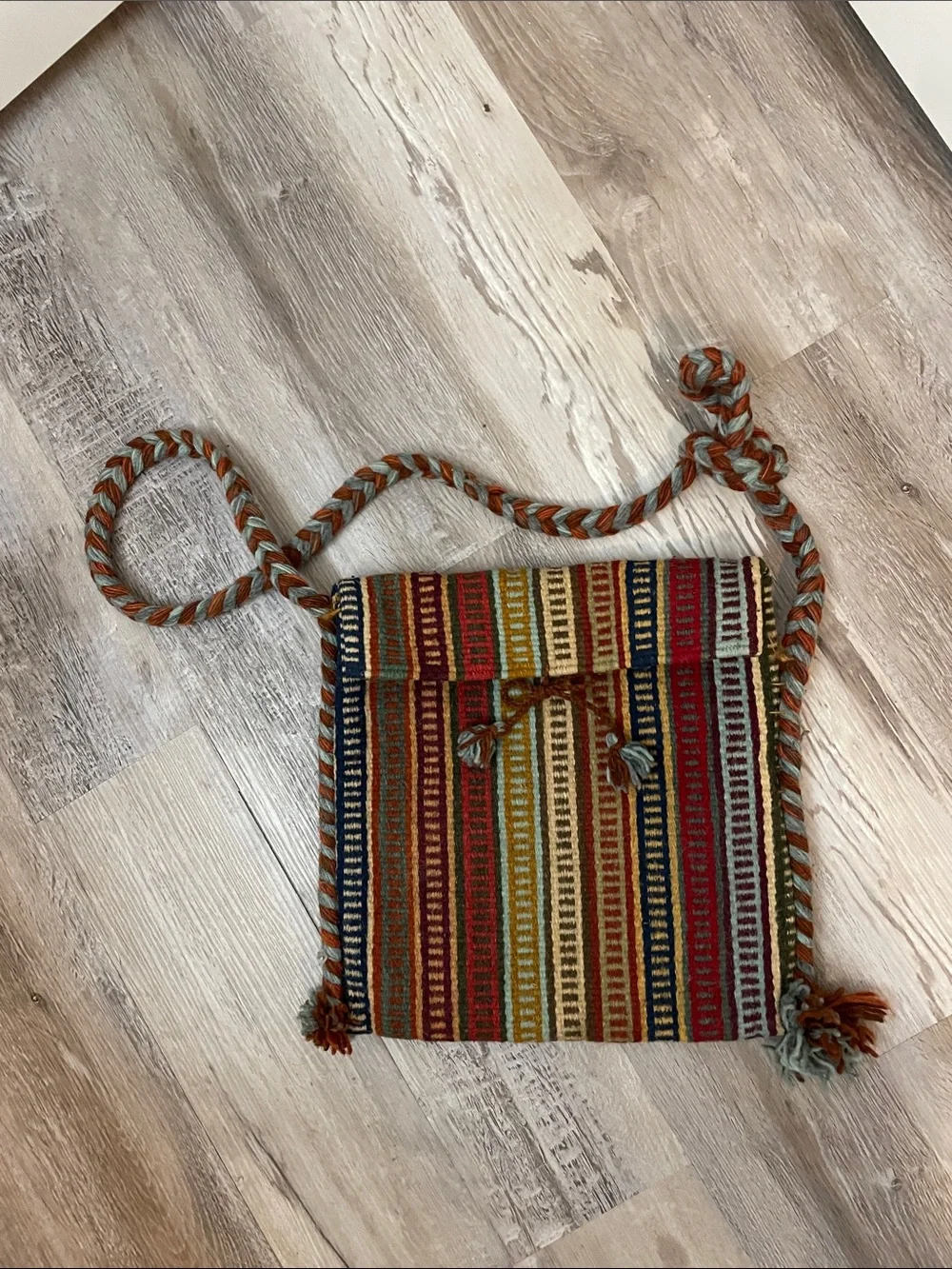 Boho woven ethnic blanket rug crossbody bag with braided strap and pompom detail